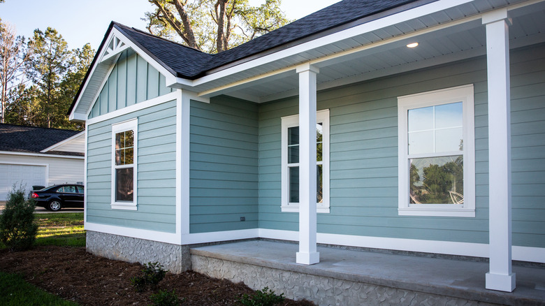 ranch style house painted light blue
