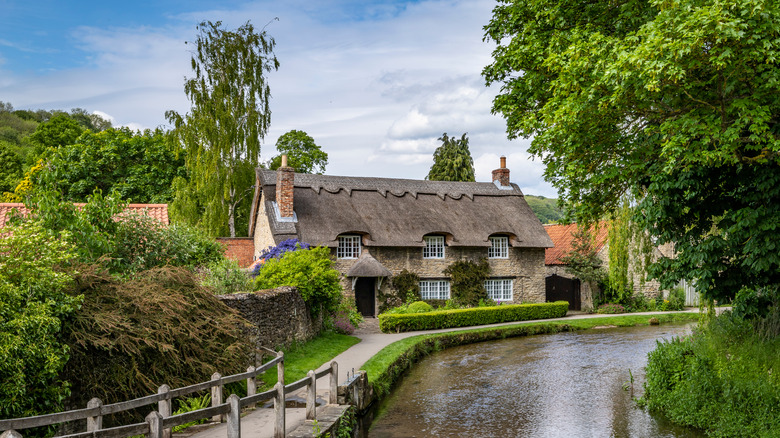 English home near a river