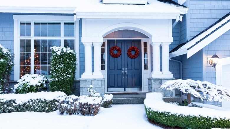 Blue house with snow