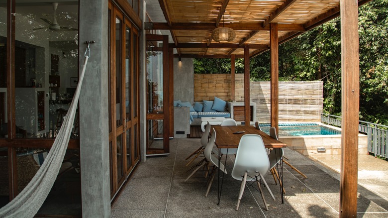 patio with swimming pool and chairs