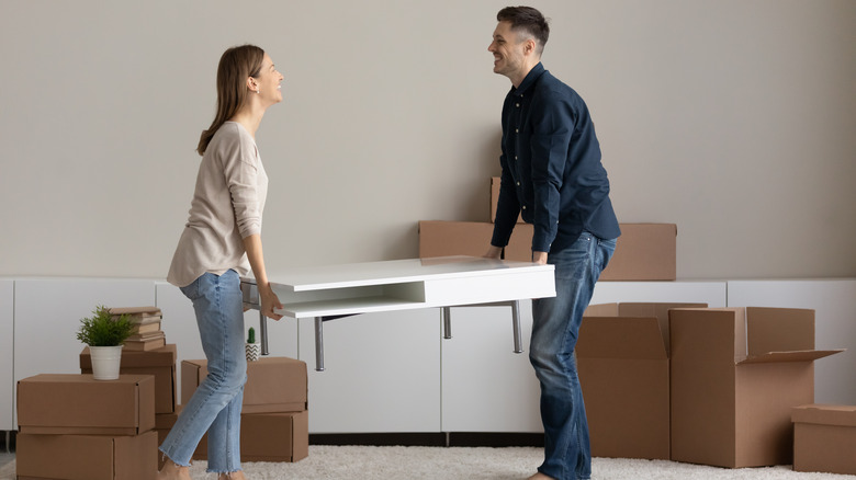 couple carrying table