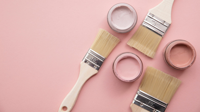 pink paint and brushes