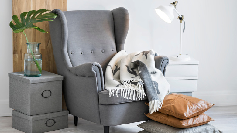 stacked pillows beside chair