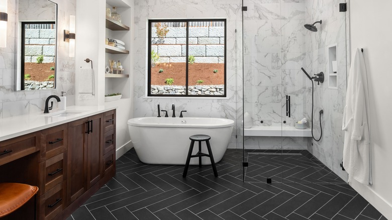 Black herringbone tiled bathroom
