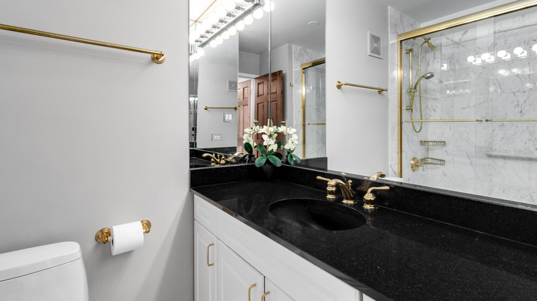 black granite with gold faucet