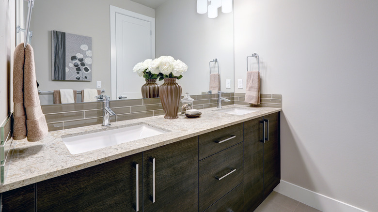 beige granite on wooden vanity