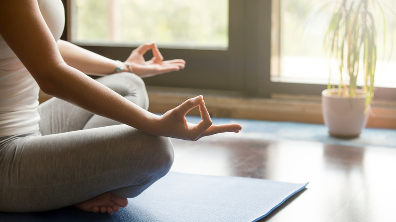 a woman on yoga mat