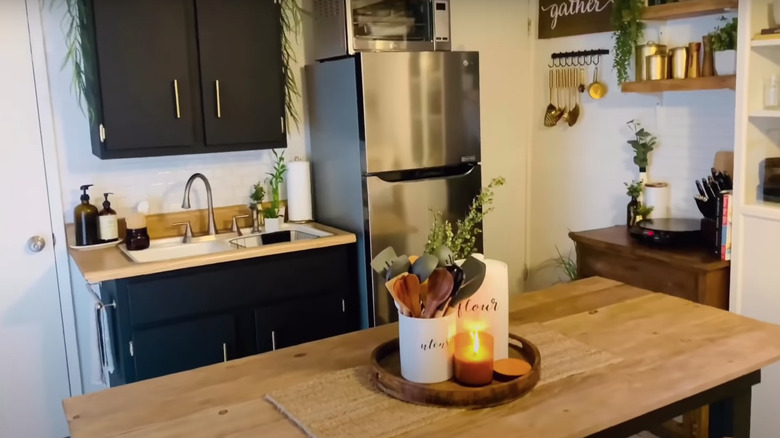 black cabinets in boho kitchen