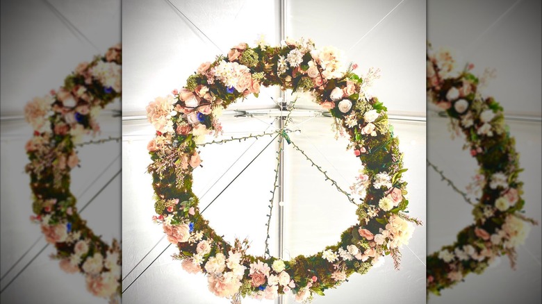 A round pink and white floral garden chandelier.