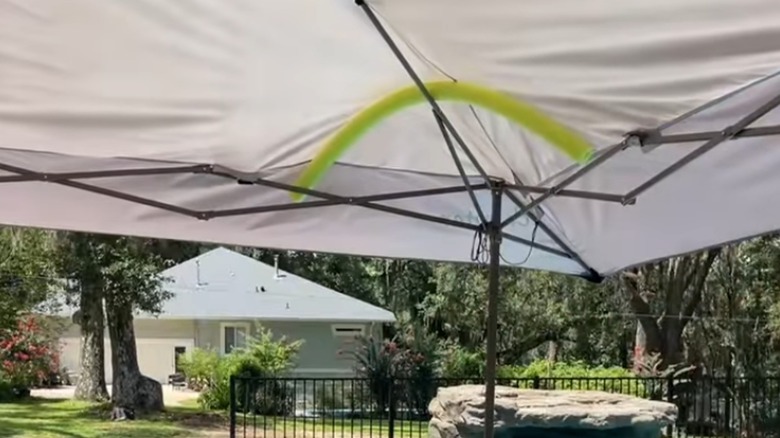 Pool noodle at the corner of canopy.