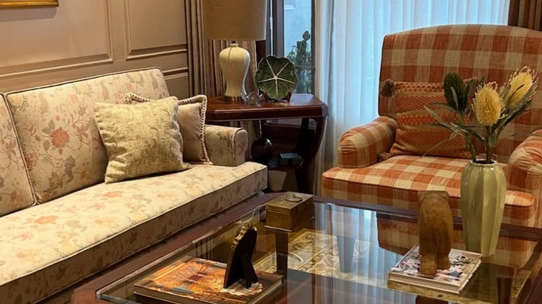 Two chintz and floral fabric couches in a living room.