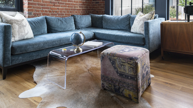 Lucite coffee table in a modern industrial home.