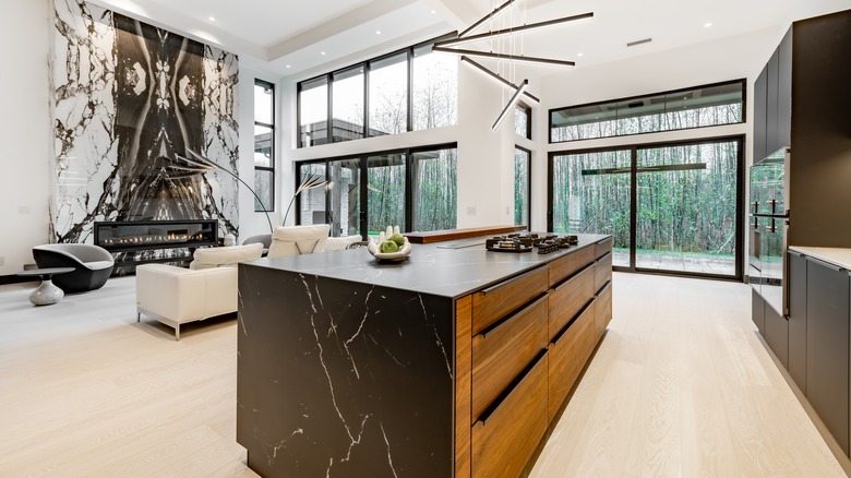 Stone accents on kitchen island and fireplace.