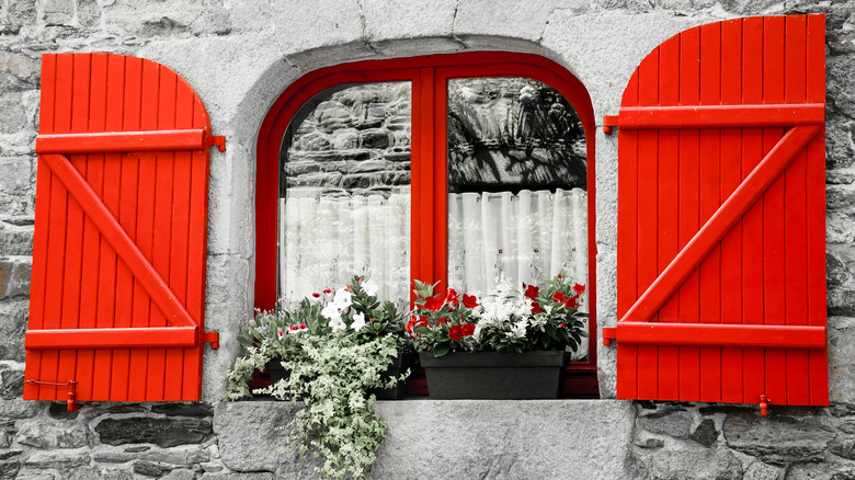 red shutters on farmhouse window
