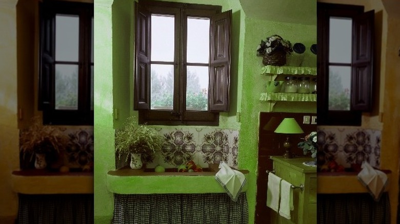 wooden shutters in green room
