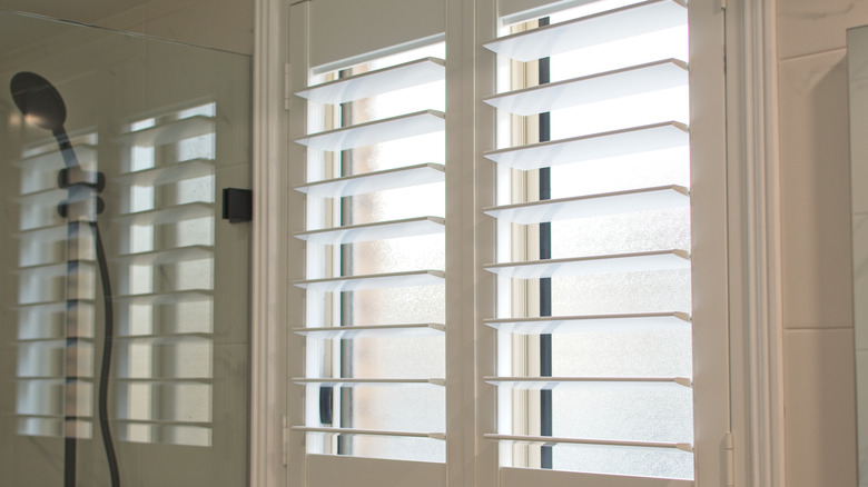 white shutters in a bathroom