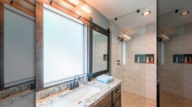 bathroom with modern sliding mirror