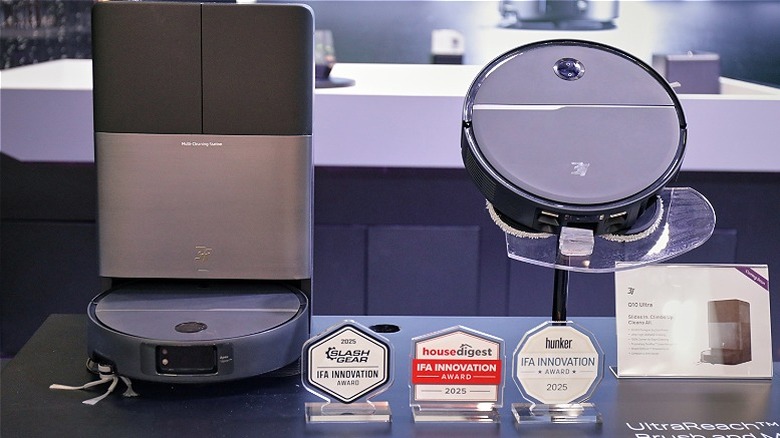 A 3i P10 Ultra robotic vacuum and mop cleaning wood floors in a modern house