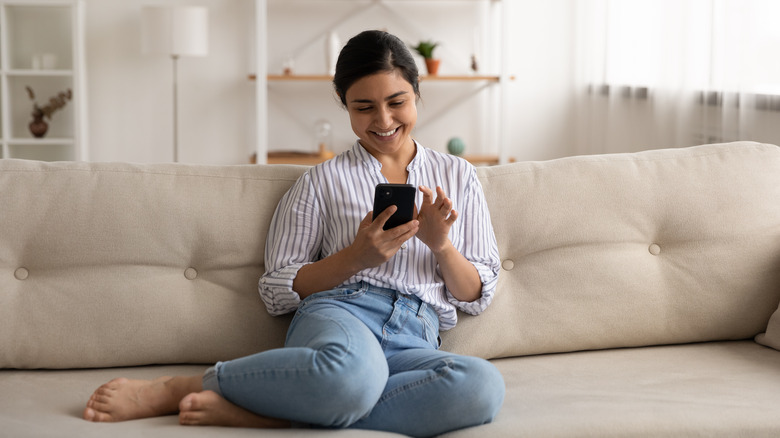 smiling woman with phone