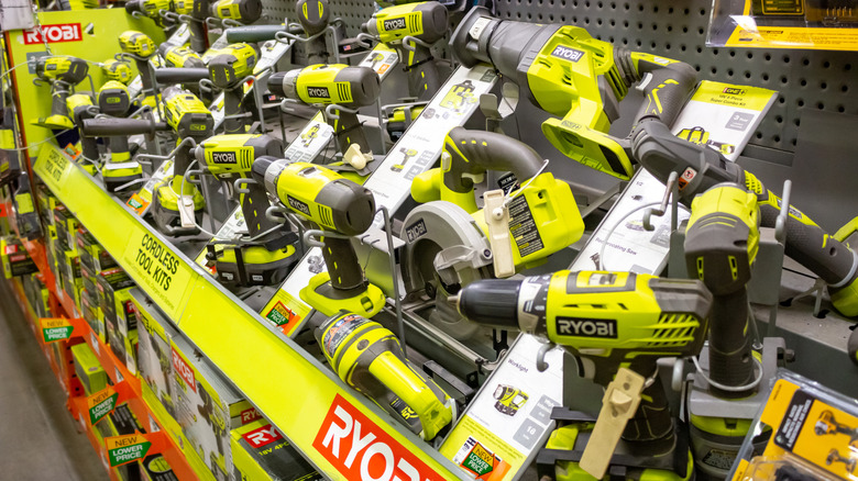 A display of cordless Ryobi tools in a home improvement store