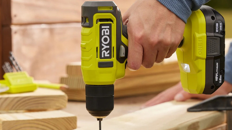 A person using the Ryobi ONE+ 18V Cordless 3/8 in. Drill/Driver on a woodworking project