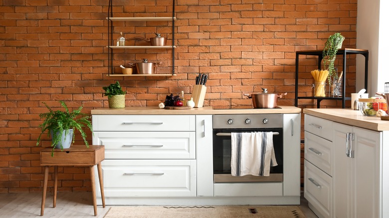 Brick kitchen with copper cookware