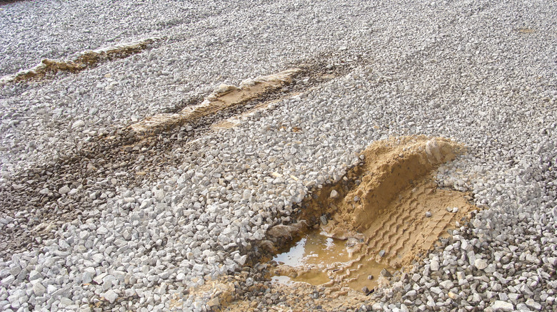 Gravel ground that has been shifted by tire tracks