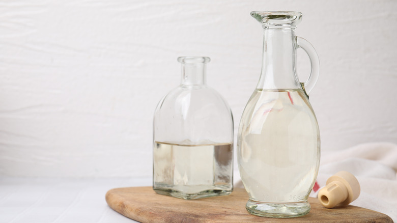 Close up of two bottles of white vinegar