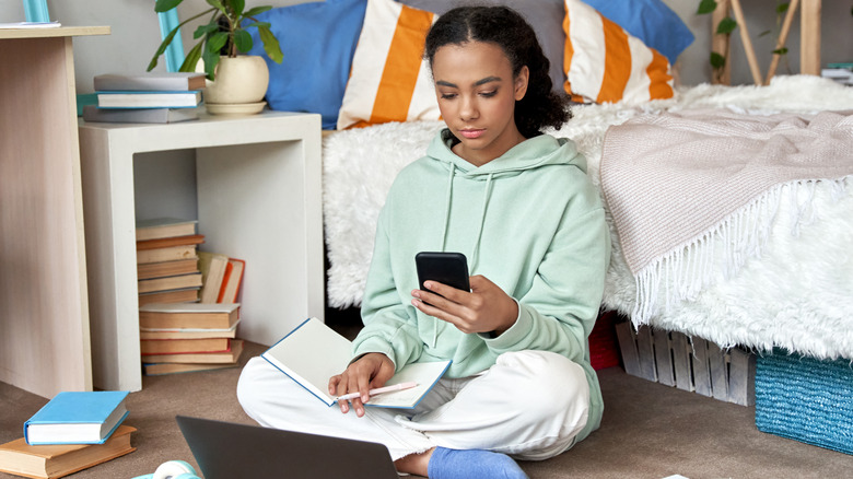 woman studying in bedroom