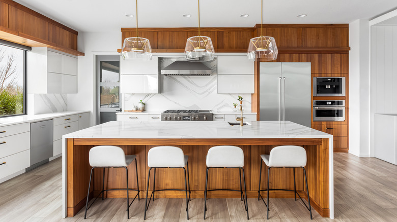 Huge kitchen with waterfall countertops