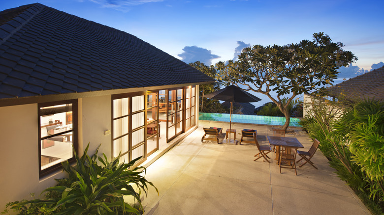a pool house with a courtyard