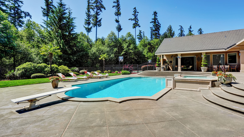 a pool house with a unique view