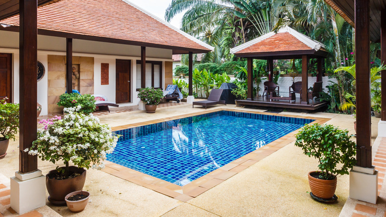a beautiful pool house setting
