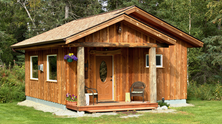 small cabin with vertical wood