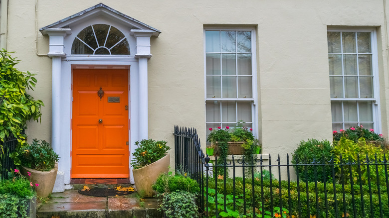 neutral home with orange door