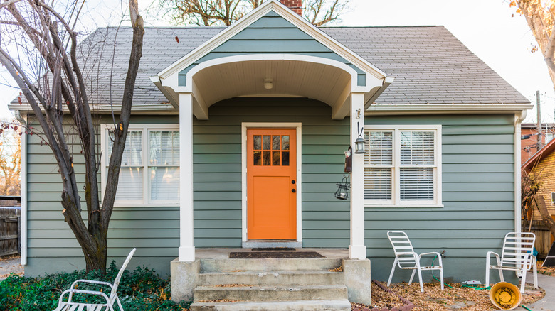 green home with orange door