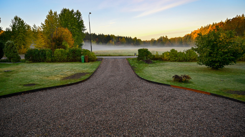 gravel driveway surronded by greenery