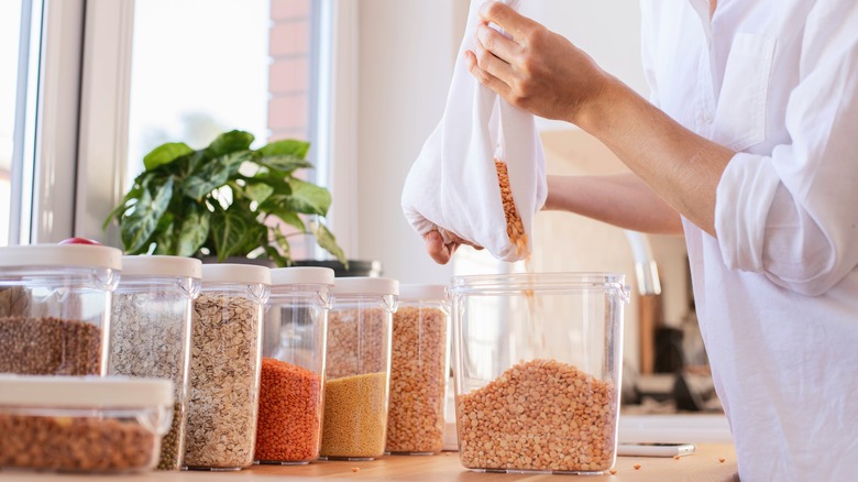 Person decanting dry food