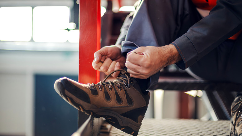 Person putting on work boots