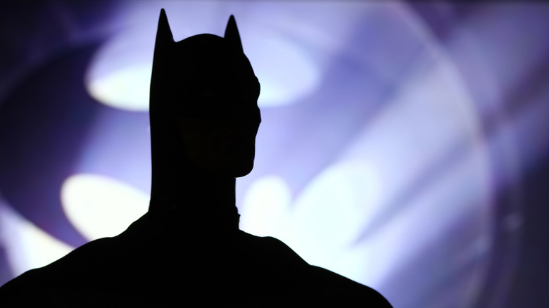 batman silhouetted by batsignal