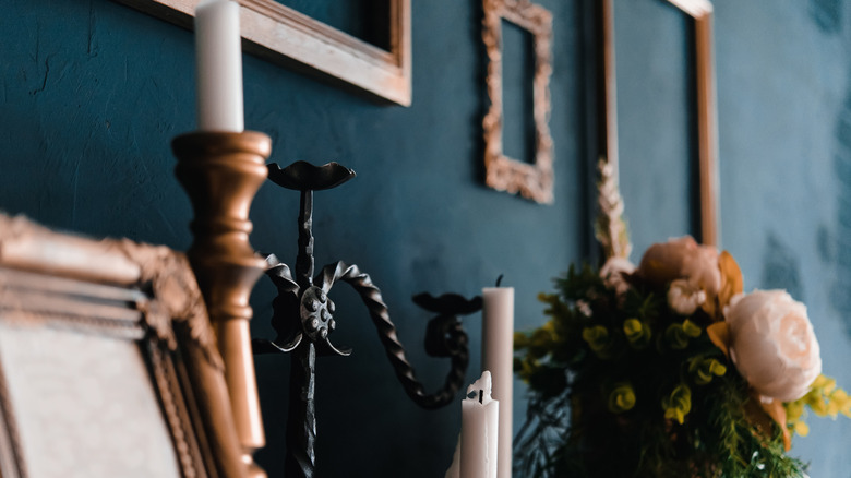 flowers and candlesticks on mantle