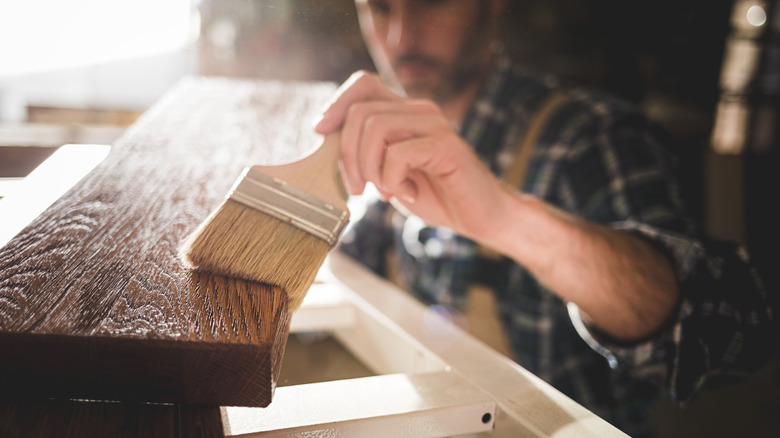 man working on wood