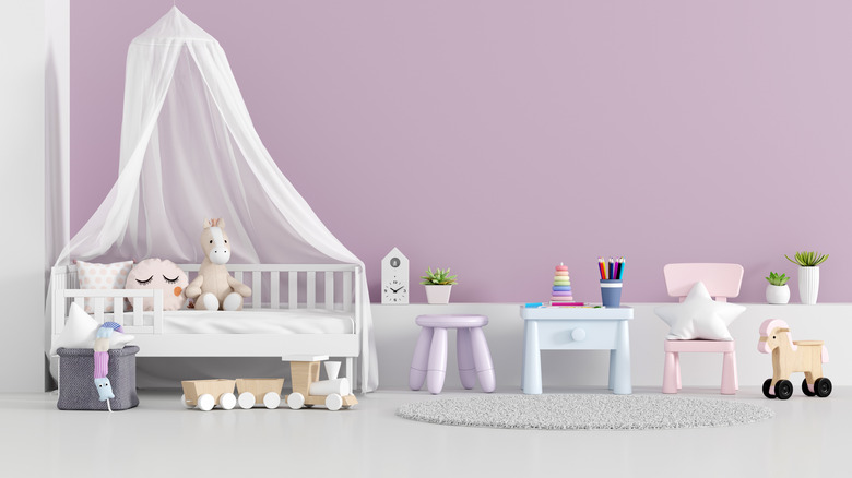 lilac nursery with white crib