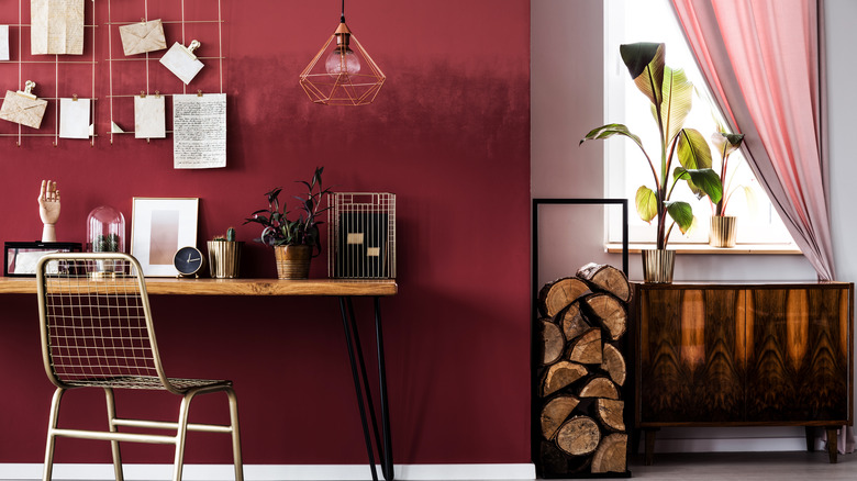Desk area with red wall