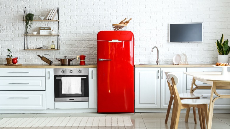 red fridge in white kitchen