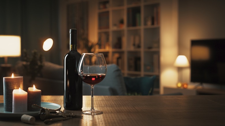 wine bottle and glass on table