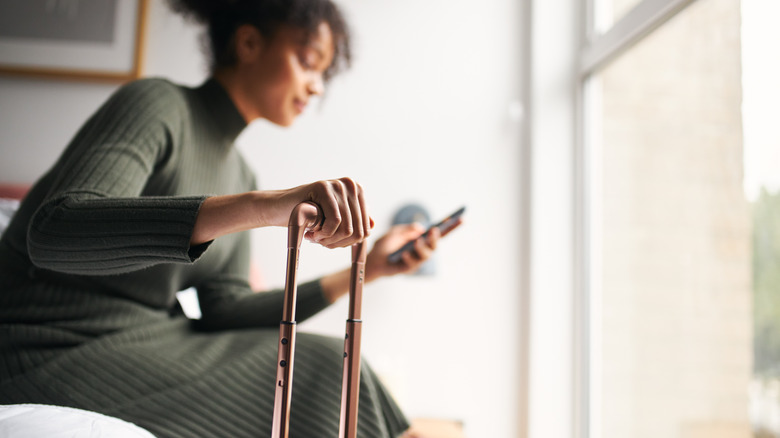 woman with suitcase in bedroom