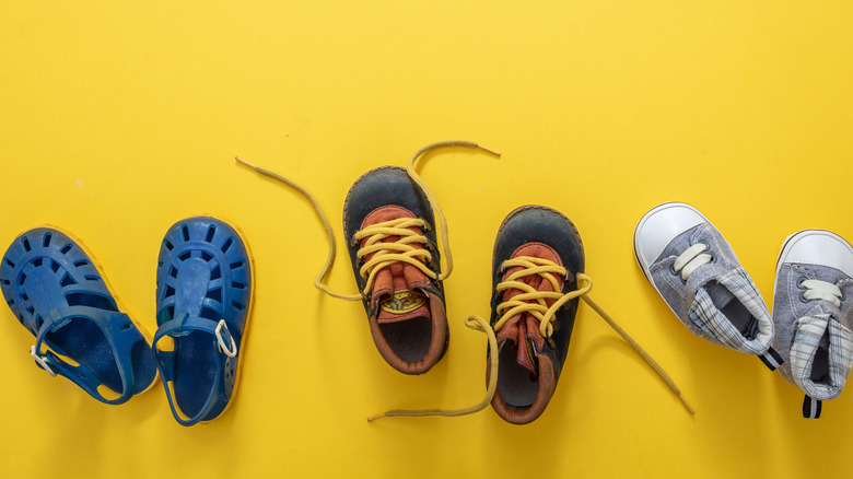 three pairs of baby shoes