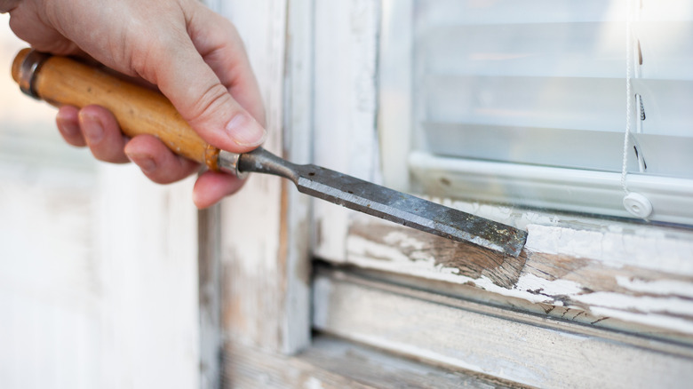 removing sash with chisel