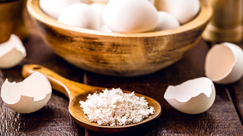 Eggs and eggshells in bowl